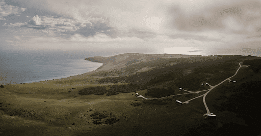 Aerial view of CABN’s off-grid cabins dotted along the Kangaroo Island coastline, highlighting the remote natural beauty and value in kangaroo island luxury escapes