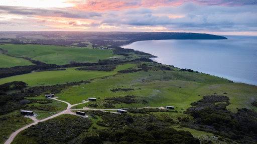 The coast of Kangaroo Island at Cape St Alban with off-grid cabins in view