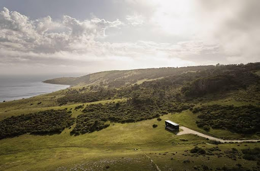 The coast of Kangaroo Island at Cape St Alban with off-grid cabins in view