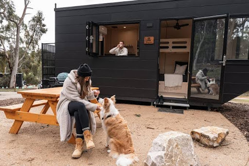 A couple having a family retreat at a pet friendly cabn in handhorf