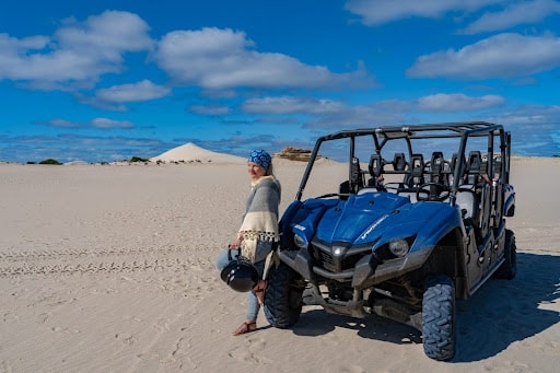 Woman by a Yamaha Viking UTV Buggy on the Little Sahara, Kangaroo Island