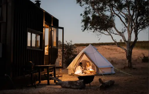 couple in a romantic weekend getaway by a cabn in mclaren vale, south australia