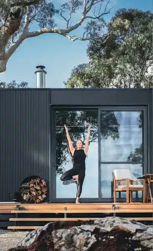 woman doing yoga during holiday accommodation in adelaide